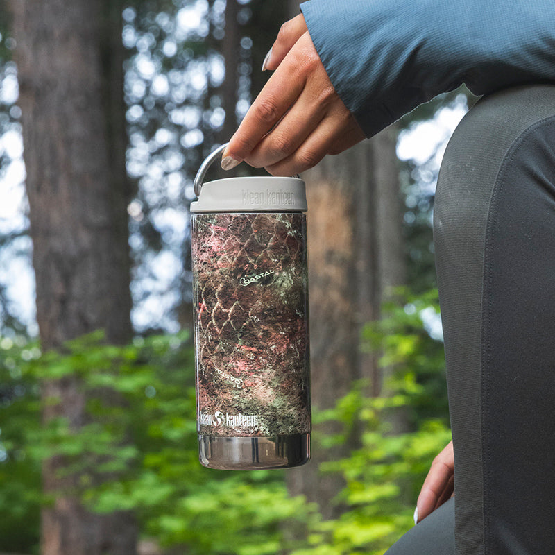 12oz-tkwide-with-twist-cap-mossy-oak-g5 12oz_tumbler_mossyoak_rainbowtrout_hand_closeup_square.jpg