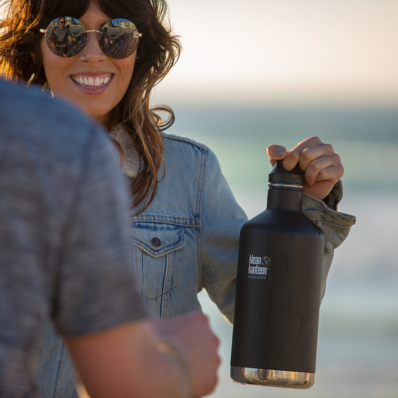 64oz-classic-with-loop-cap-w0 64oz_insulated_classic_black_beach_girl_hand_square.jpg