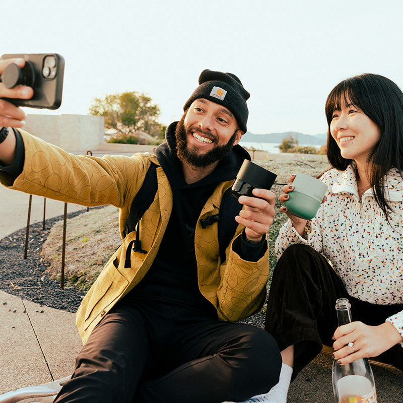 bring-your-own-party-kit-tumblers-and-cocktails-w0 8oz_rise_lowball_black_iceberg_couple_selfie_city_square.jpg