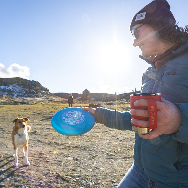 12oz-camp-mug-d0 insulated_camp_mug_12oz_woman_dog_frisbee_square.jpg